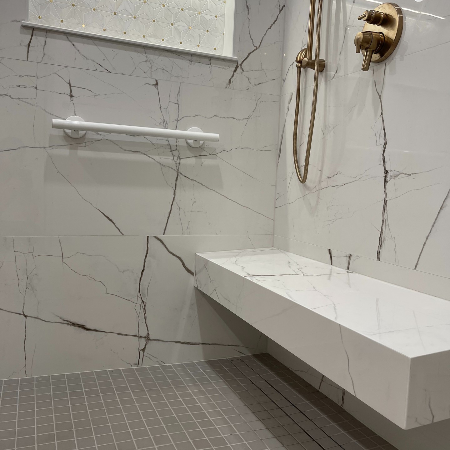 Precision tile installation with alignment, niche, and bench details